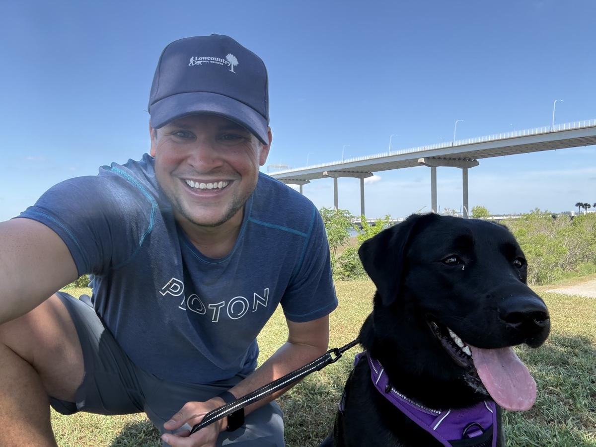 Walker selfie with a black lab on a walk